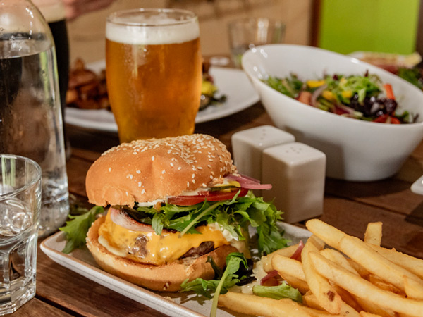 beef burger with fries and beer at Bootleg Brewery