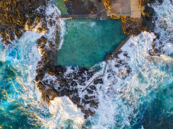 Aerial overlooking Blowhole Point Rock Pool, Kiama