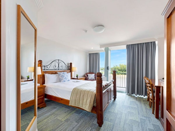 Country style bedroom at Burnett Riverside Hotel