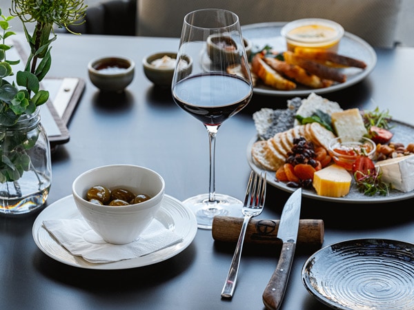 wine with snack platter at Rocco Rooftop bar in Cairns