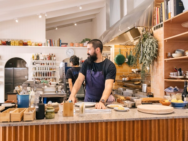 Man standing in Alberta's Kitchen and Store