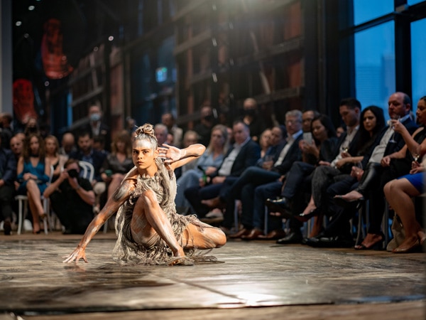 A girl dancing around people.