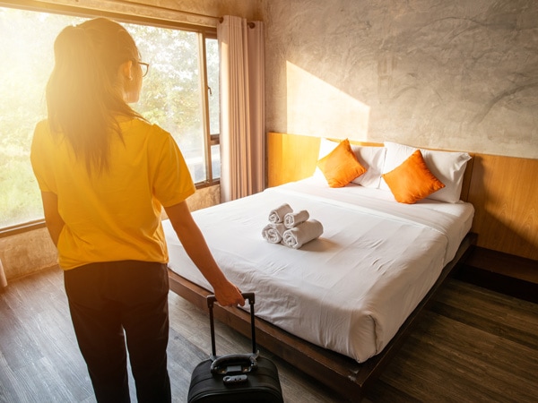 woman after checking in her hotel while travelling solo in Australia