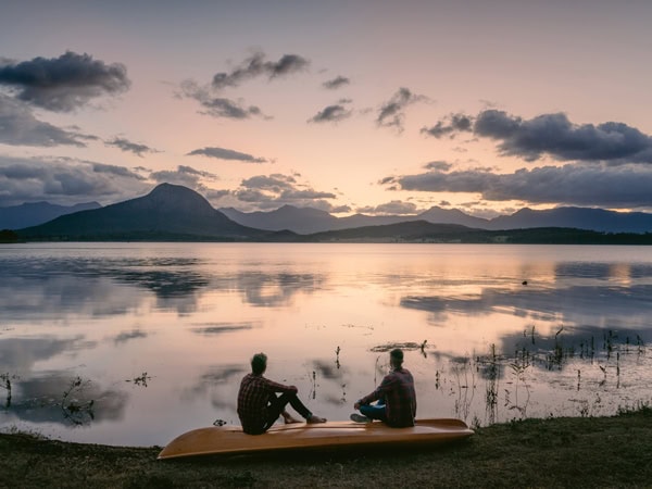 two people sitting on a kayak at Lake Moogerah at sunset