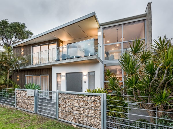 A house with lights and plants.
