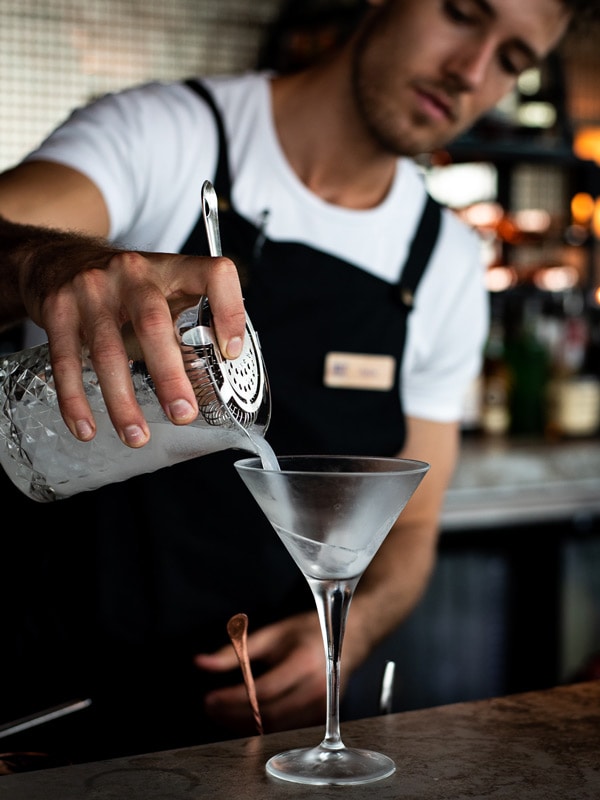 bartender pouring a drink at Rocco