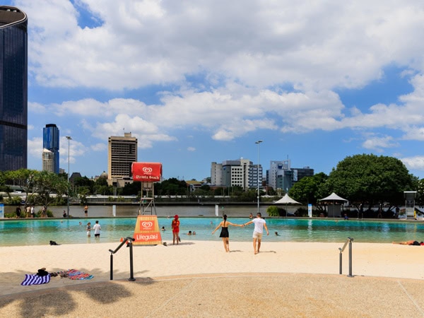 a couple walking down to Streets Beach, South Bank