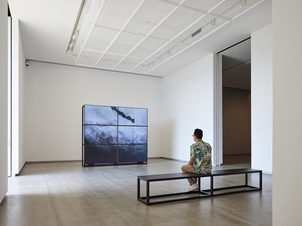 a man sitting while admiring art inside TarraWarra Museum of Art