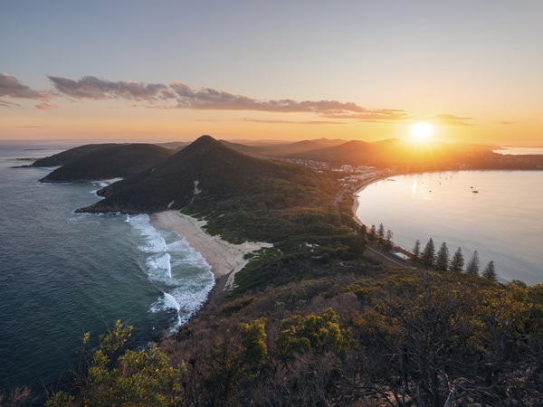 Mountains and the ocean at sunset.