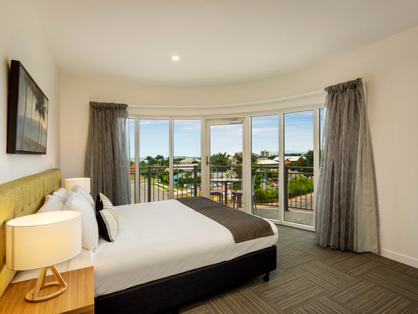 a contemporary apartment with windows that open out to scenic views at Quest Townsville on Eyre
