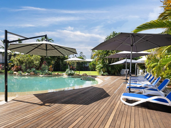 the pool area with sun loungers at Mercure Townsville