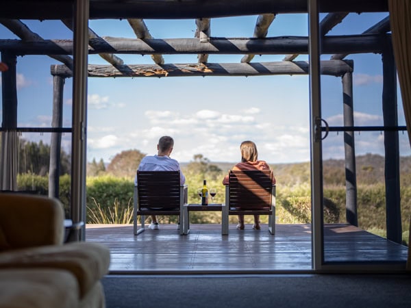 a couple sitting while admiring the scenic landscape at Alure Stanthorpe