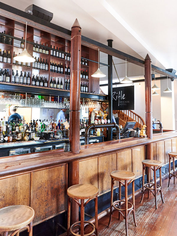 empty stools at the timber bar of Rifle Brigade Hotel, Bendigo