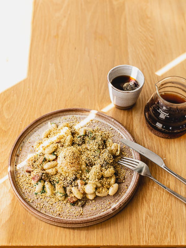 The Breakfast Carbonara with a long black coffee from Morning After in Brisbane