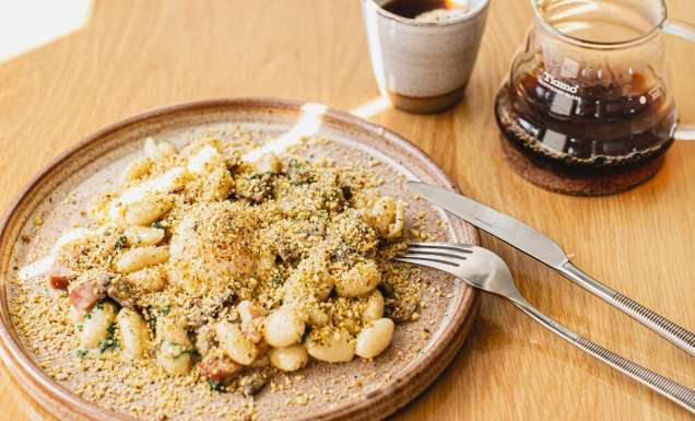 The Breakfast Carbonara with a long black coffee from Morning After in Brisbane