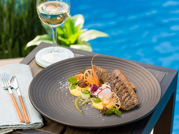 food and drink by the pool at Rydges Palmerston, Darwin resort