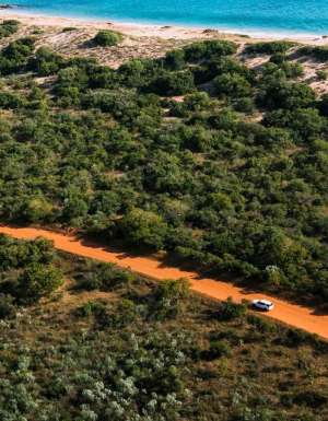 Car driving along dirt road in Broome