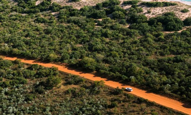 Car driving along dirt road in Broome