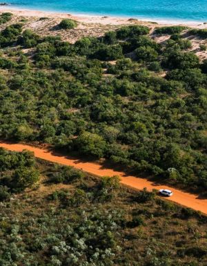Car driving along dirt road in Broome