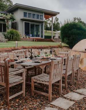 Outdoor dining area and woodfired oven in Yarramalong