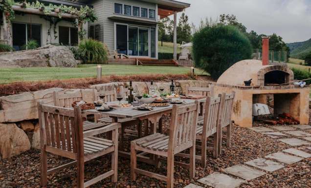 Outdoor dining area and woodfired oven in Yarramalong