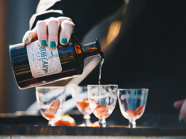 pouring Apothecary gin into a glass at Killara Distillery, Richmond