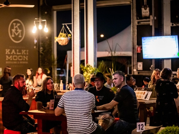 guests talking while drinking booze at Kalki Moon Distillery, Bundaberg