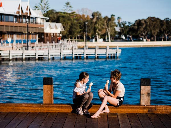 kids eating ice cream along Mandurah seaside promenade