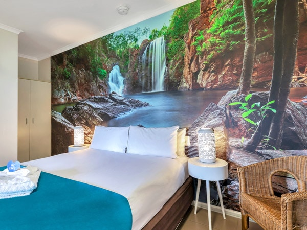well-lit bedroom with cosy amenities at Darwin Freespirit Resort