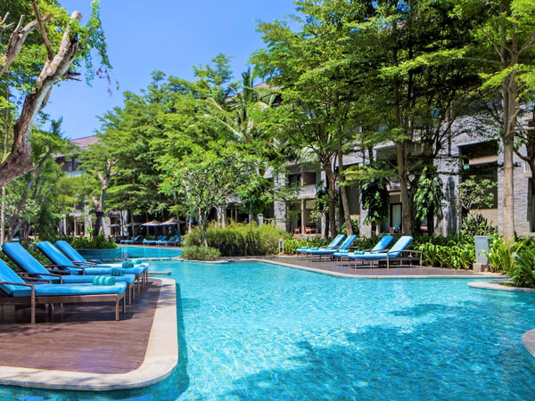 a pool with sun loungers at Courtyard By Marriott Darwin