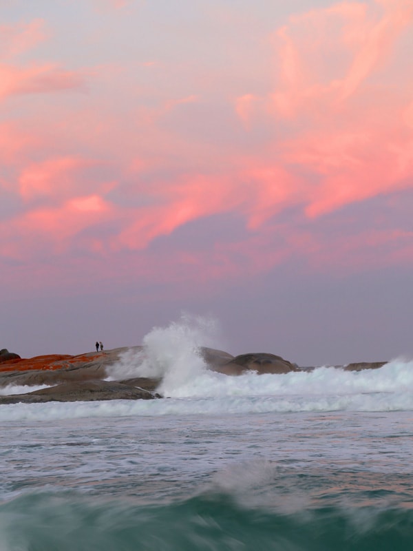 Pink sunset over Cosy Corner beach in Bay of Fires Tasmania