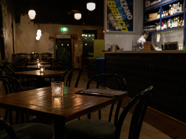 a dimly lit bar interior at Stone House Wine Bar & Kitchen, Darwin