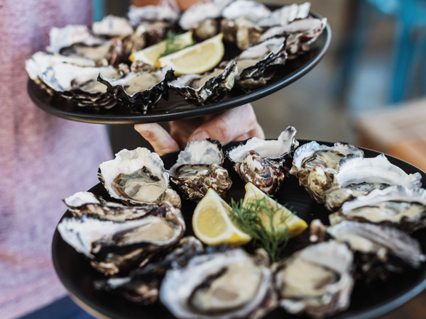 two platters of Get Shucked oysters