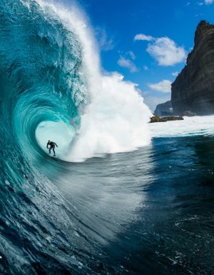 Surfer riding a wave at Shipstern Bluff