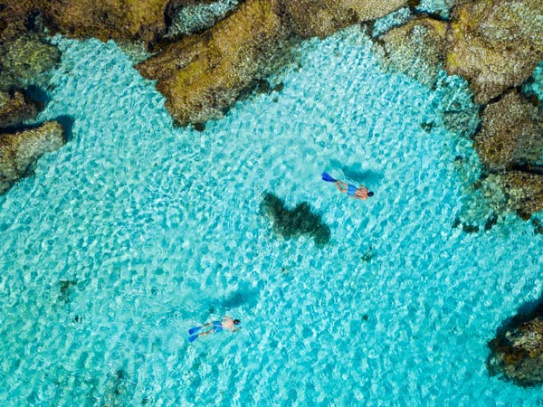 People snorkelling at Little Salmon Bay on Rottnest Island