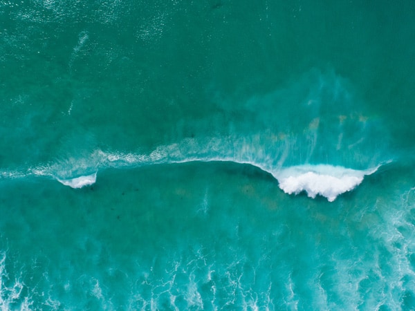 Drone shot of waves crashing at Martha Lavinia Beach on King Island in Tasmania