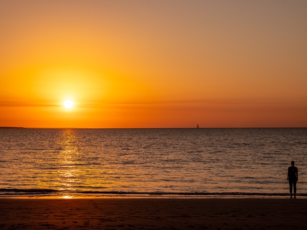 The sun setting on Mindil Beach in Darwin - one of the best beaches in Australia