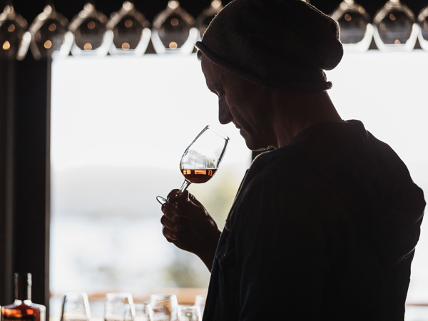 a man savouring a glass of Tasmanian single malts at the Bruny Island House of Whisky