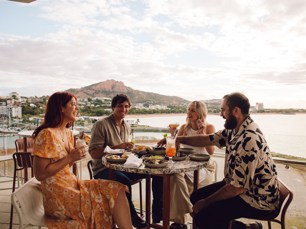 friends dining and drinking at Ardo Rooftop, Townsville