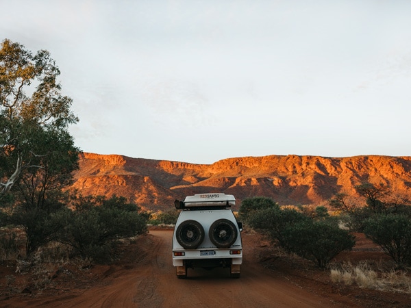 a 4WD navigating the rugged landscape in Mt Augustus National Park, WA