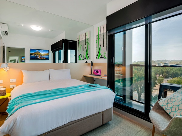a bedroom suite with balcony at Mercure Bendigo Schaller