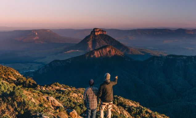 Two men at the top of Mount Barney after hike in Brisbane