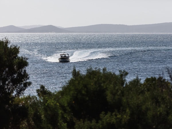 a boat sailing across the sea, Bruny Island Cruises by Pennicott Wilderness Journeys
