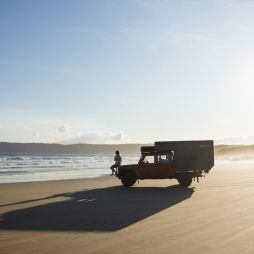 a person sitting on a 4WD vehicle on Cloudy Bay