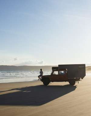 a person sitting on a 4WD vehicle on Cloudy Bay