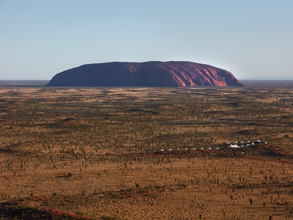 a rocky and rugged landscape in Uluru