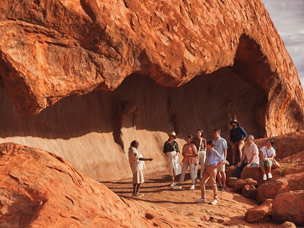 a group of travellers on a Mala Walk tour at Uluru