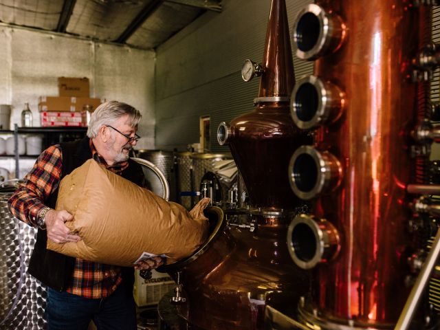 a man taking over the brewing process at Settlers Spirits, McLaren Vale