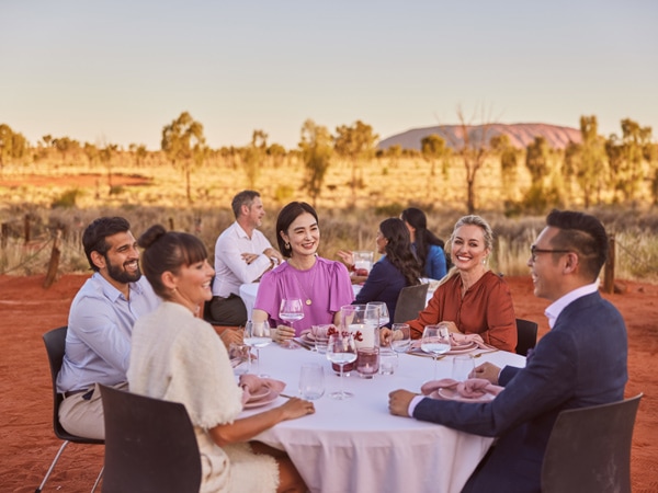 a group of travellers having dinner