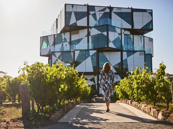 Woman walking toward d'Arenberg Cube in McLaren Vale